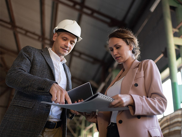 Engineers looking at blue print