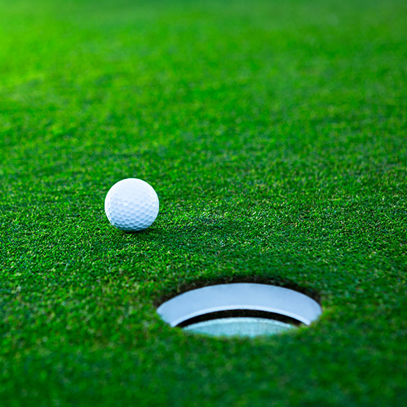 Golf ball near hole
