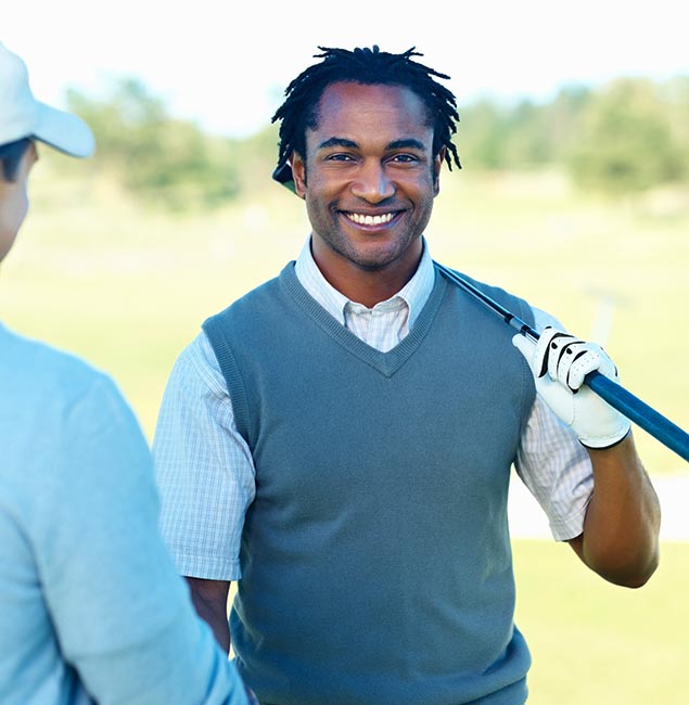 Golf partners discussing strategy on the course