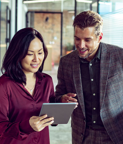 Colleagues looking at an iPad