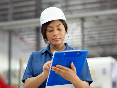 risk prevention worker with helmet and clipboard
